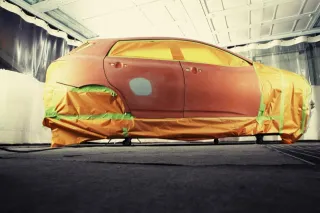 A car body prepared for work in a paint workshop