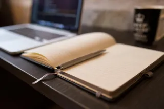 A notebook and pen for planning