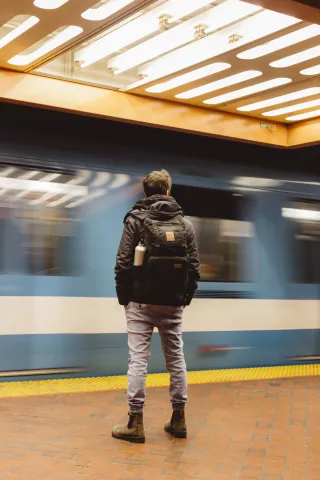 A commuter waiting at a station