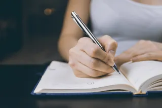 A woman writing notes